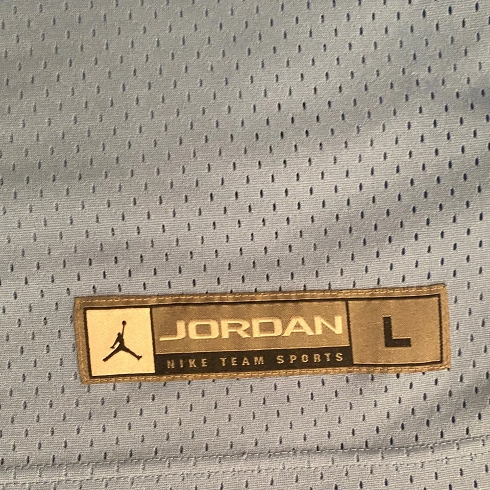 Jordan Carolina Blue and Black Basketball Jersey